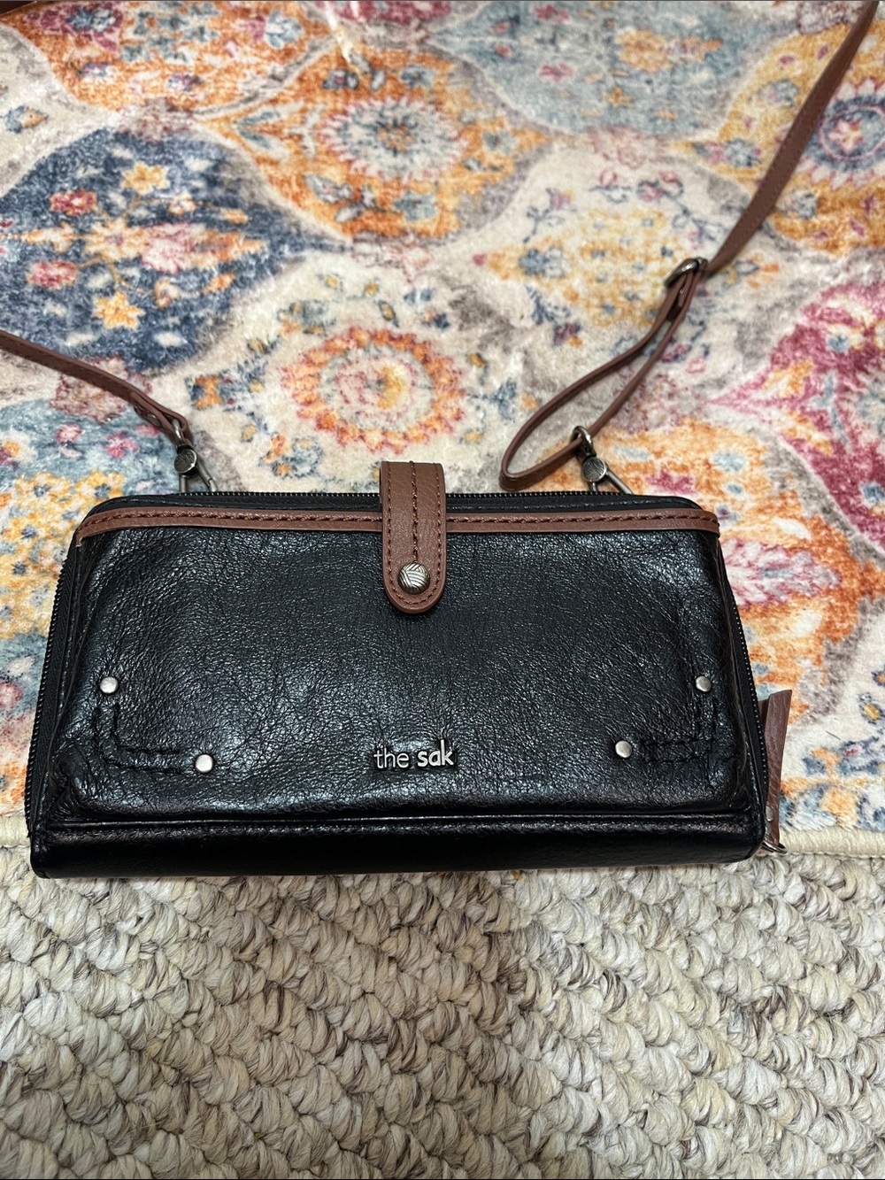 The Sak Black Leather Crossbody with Brown Trim and Strap / doubles as clutch